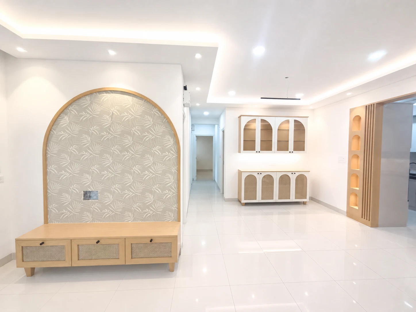 3 BHK TV and crockery unit with arched detailing and warm wood finish