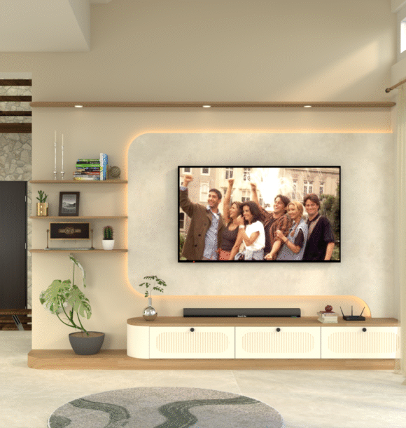 Modern living room TV unit with curved textured feature wall, wall-mounted TV, cream fluted storage cabinets, wooden open shelves, indoor plants, staircase, sheer curtains, and warm ambient lighting.
