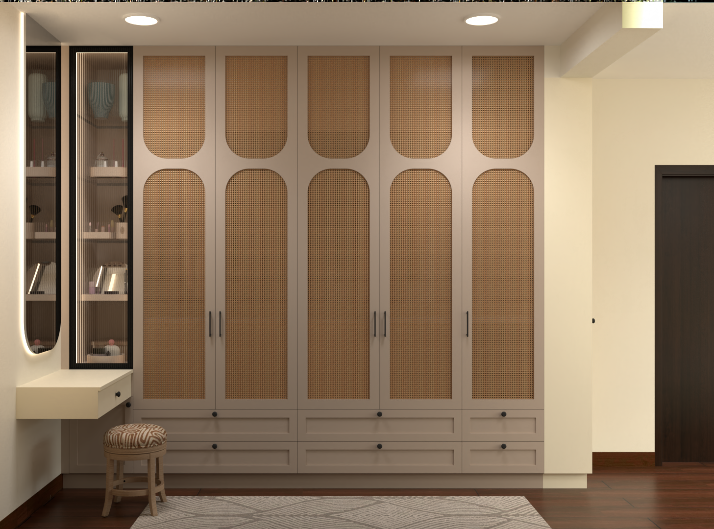 Floor-to-ceiling wardrobe with cane-panelled shutters, integrated drawers, fluted-glass display cabinets and a compact dressing niche.