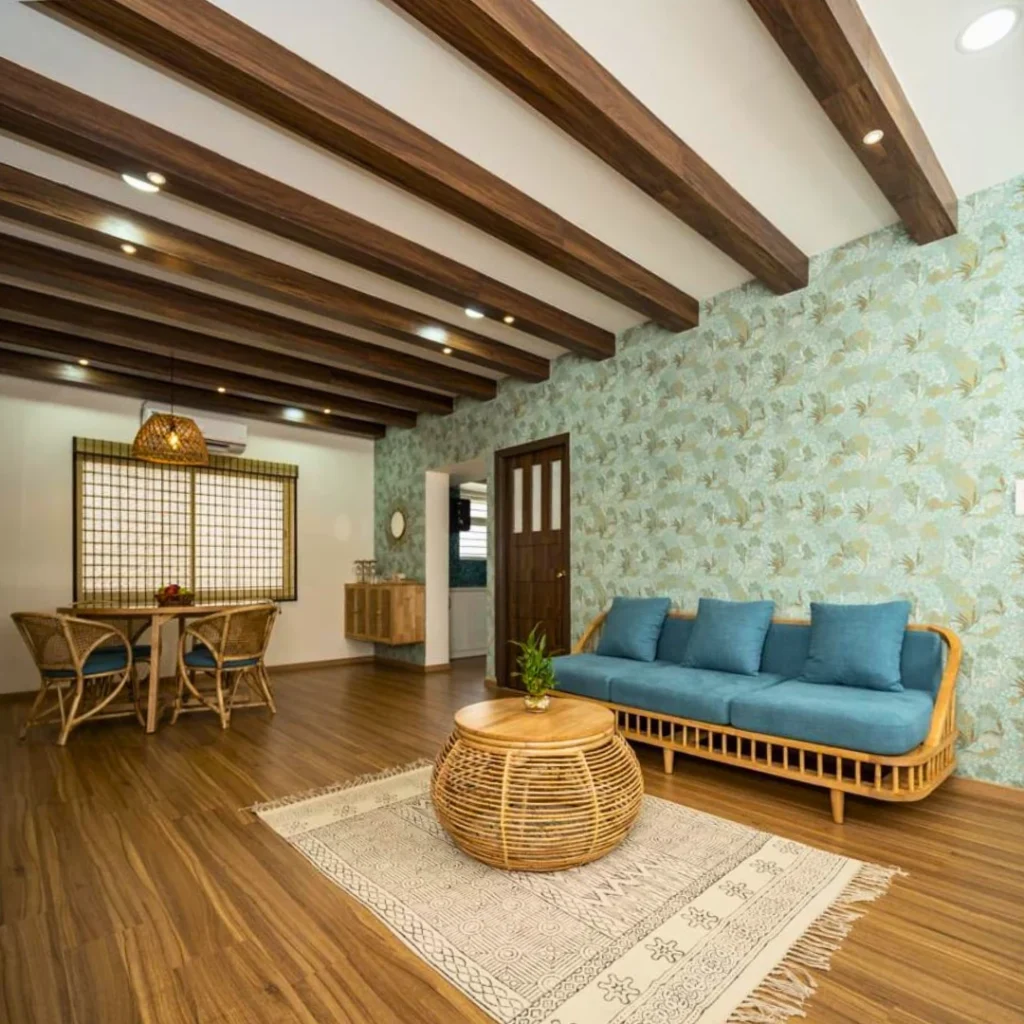 Boho-inspired living room with wood ceiling beams and cane furniture