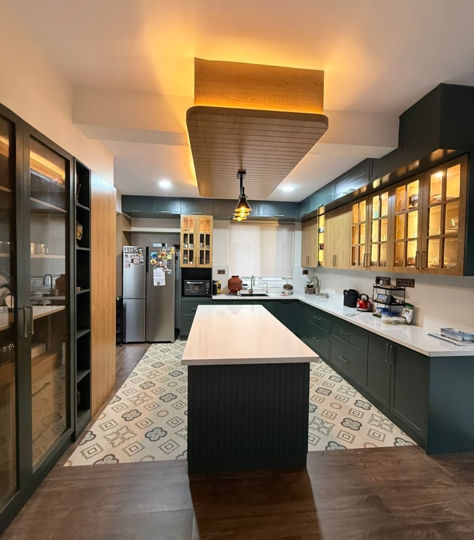 Completed Azven Breathe green kitchen with island and patterned flooring