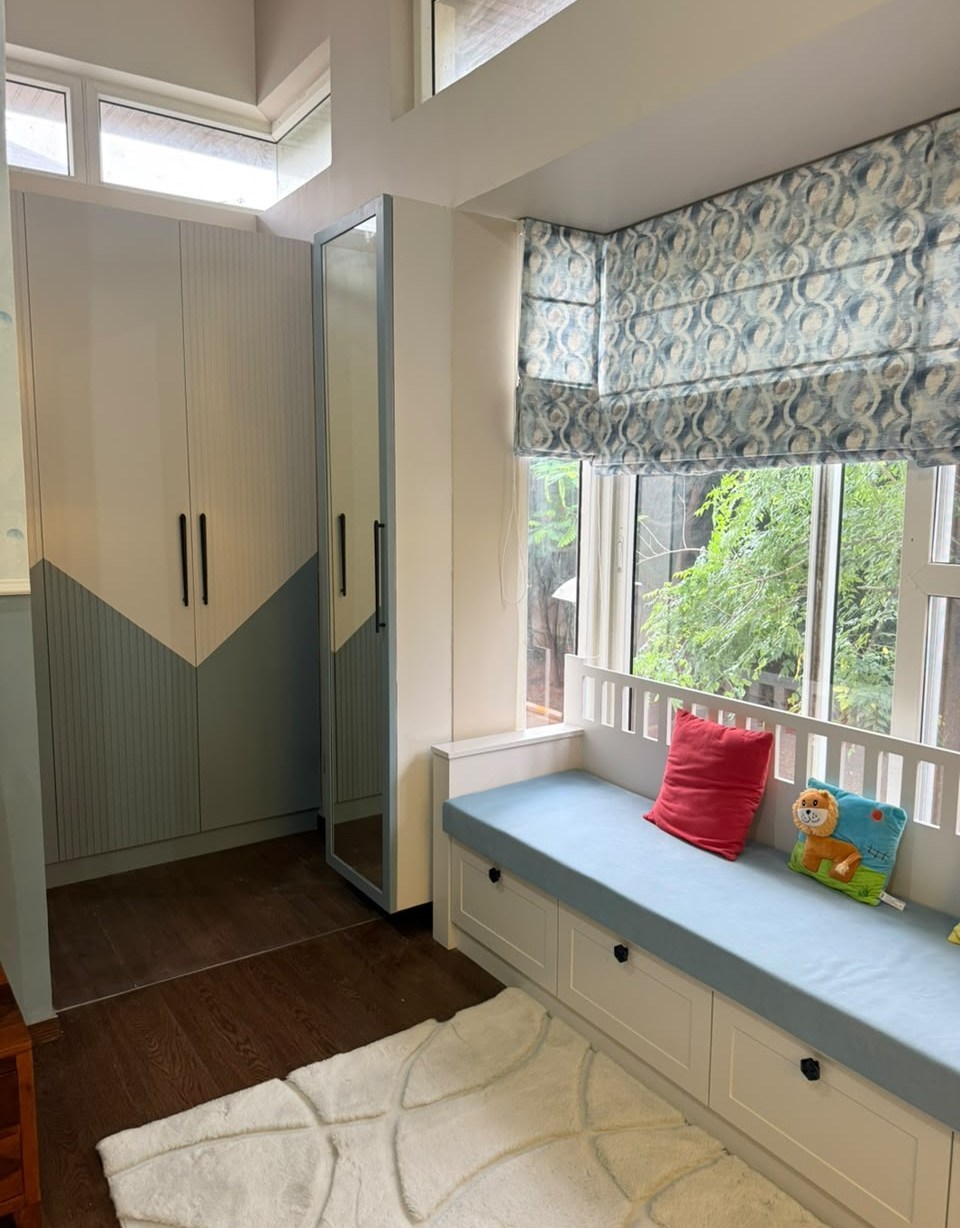 Completed Azven Breathe child's room study and house-shaped cabinetry
