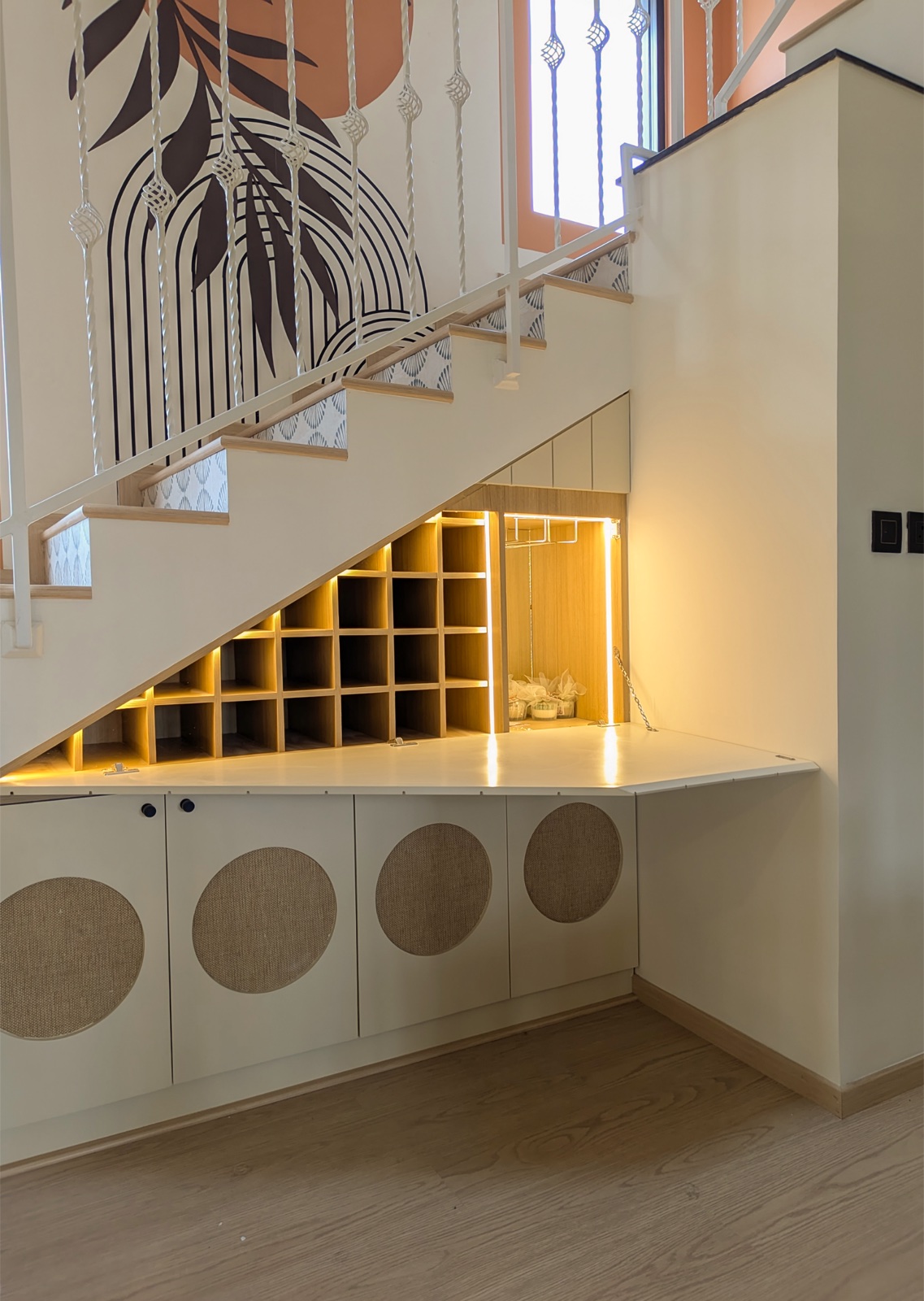 Completed interior: Under-stair unit open to reveal illuminated storage