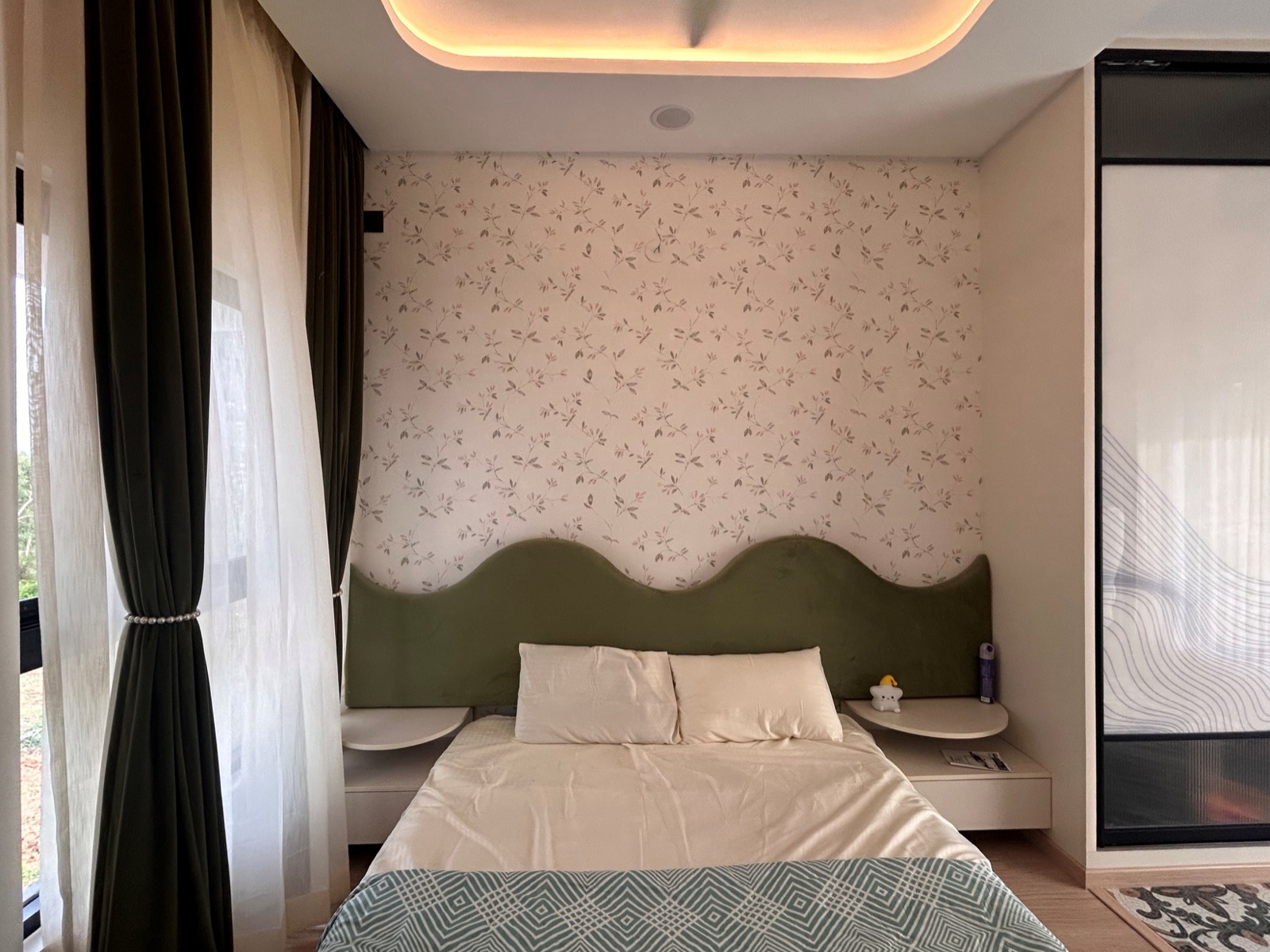 Completed interior: Green-and-blush bedroom